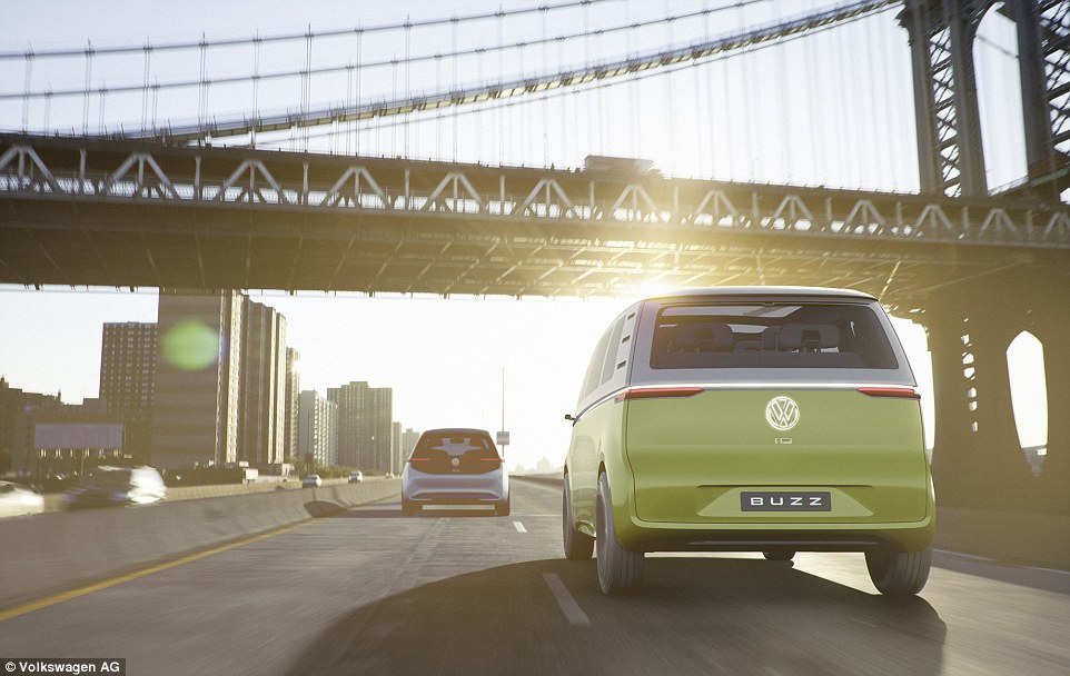 two tone vw id buzz front view on road with bridge